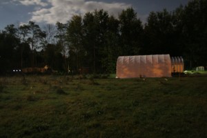 Barn bathed in the full moon and aglow with sodium light 